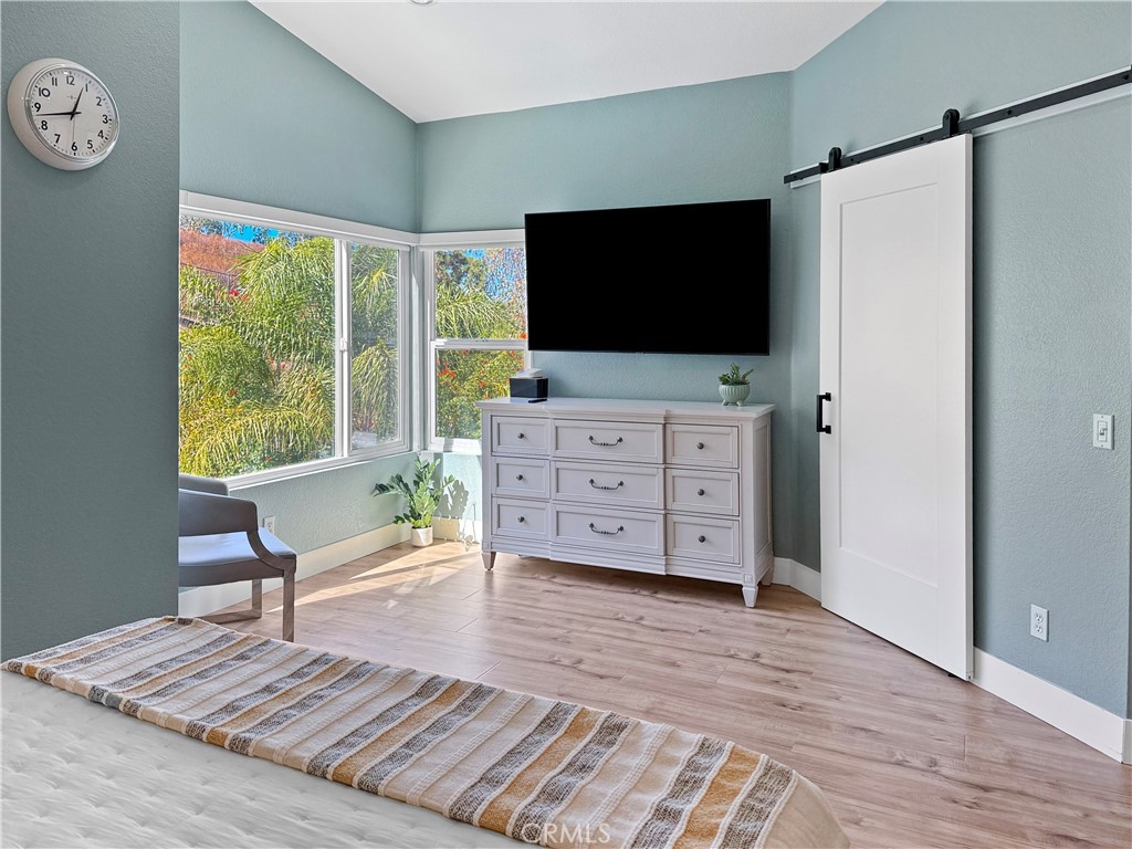 16955 Lake Knoll Parkway Riverside, CA 92503 - Photo 13 of 42 a living room with furniture and a flat screen tv