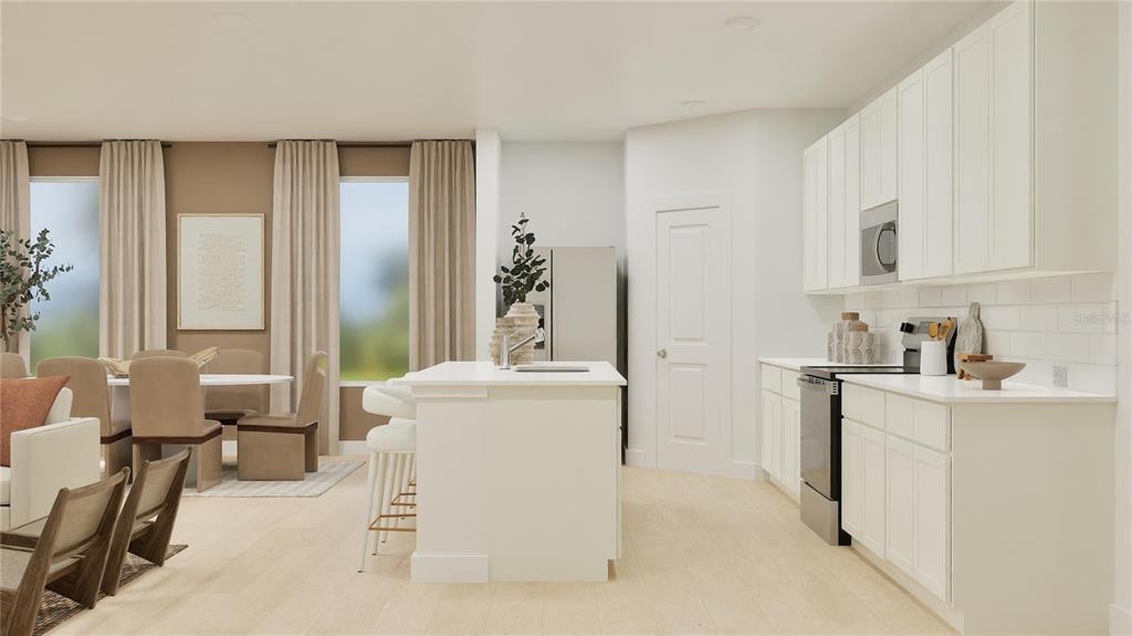 909 Tundra Loop Groveland, FL 34736 - Photo 3 of 25 a living room with furniture and a open kitchen view