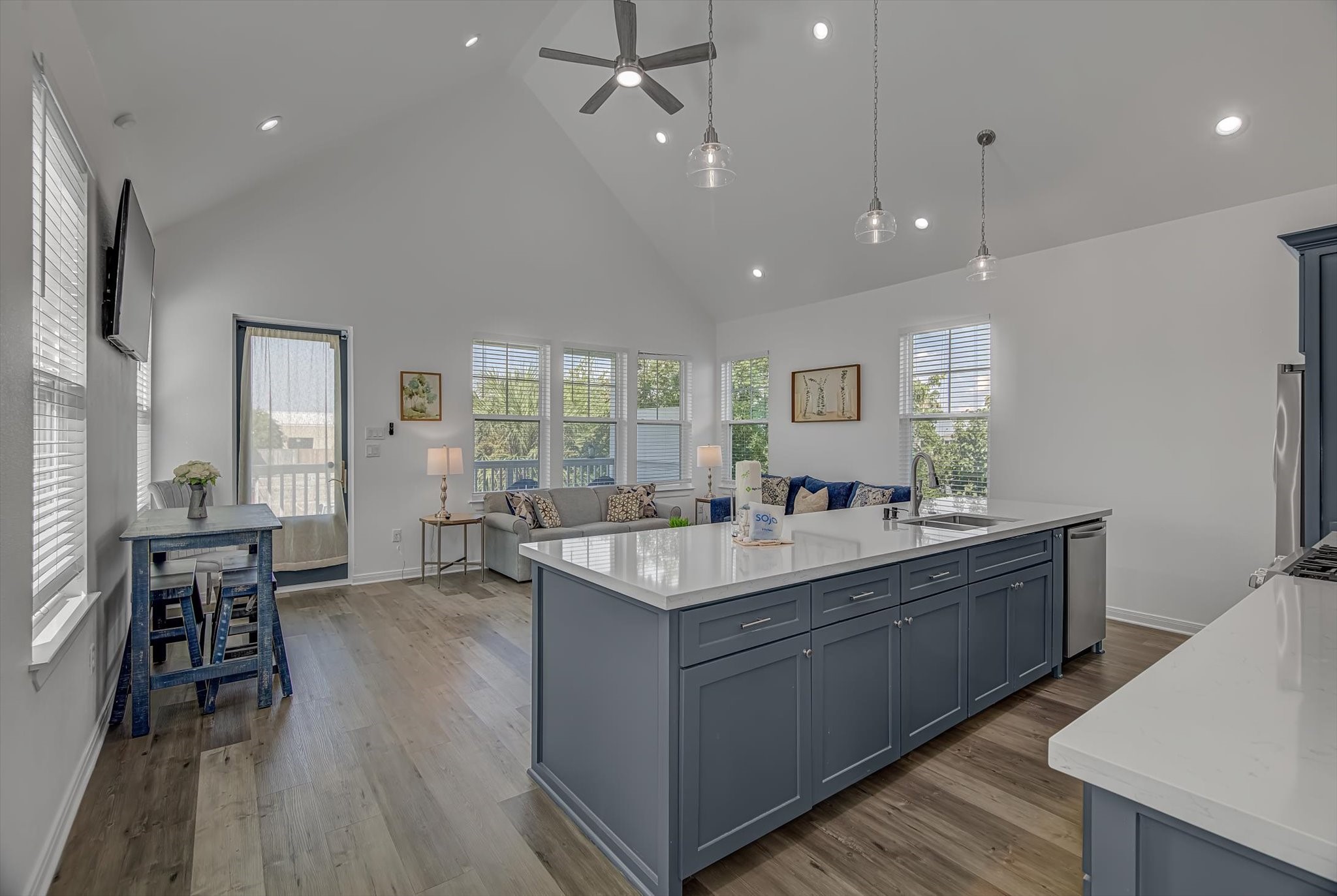 2301 67th Street Galveston, TX 77551 - Photo 12 of 46 a room with stainless steel appliances kitchen island granite countertop a stove and a wooden floors
