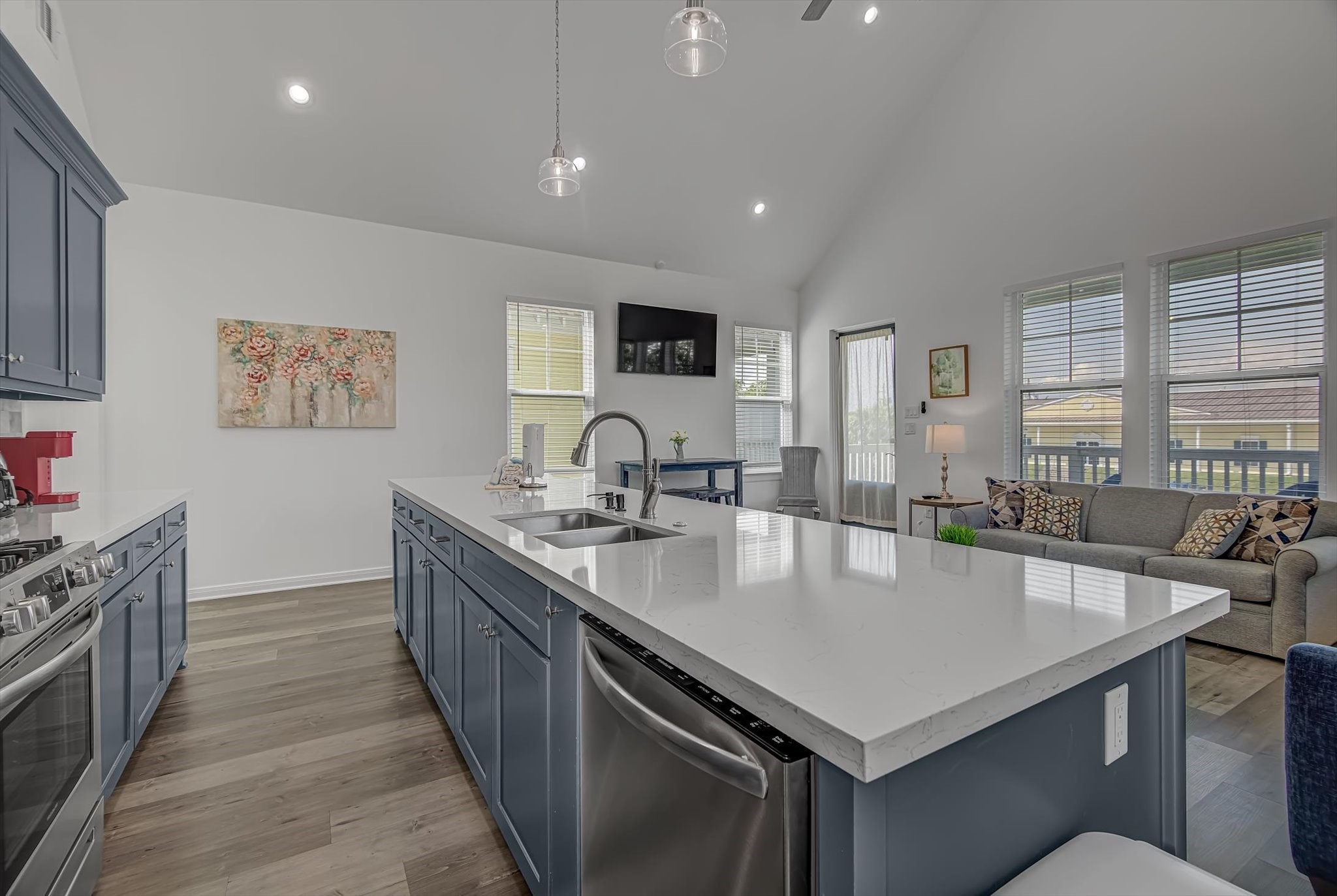 2301 67th Street Galveston, TX 77551 - Photo 15 of 46 a kitchen with stainless steel appliances granite countertop a sink a stove and a refrigerator