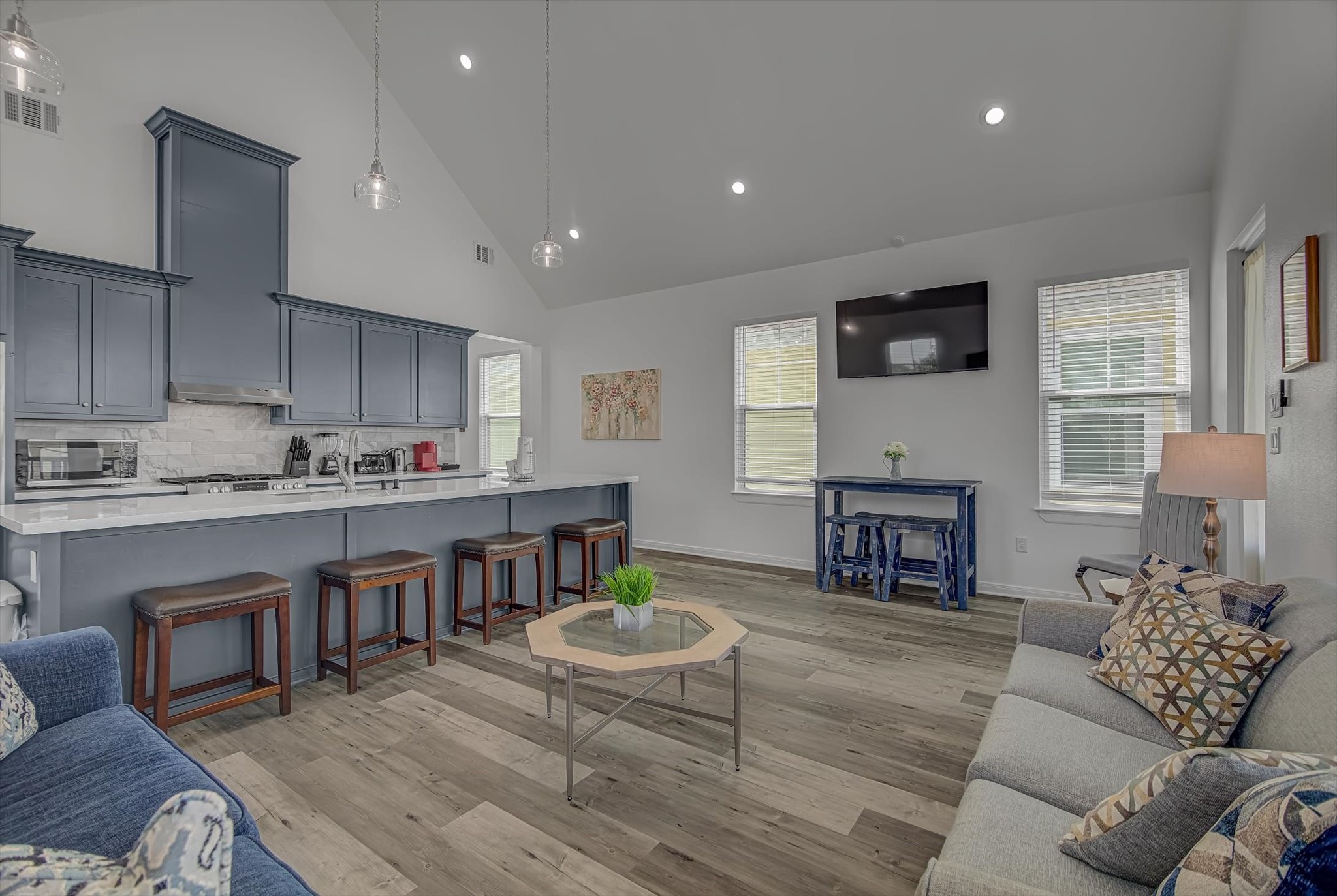 2301 67th Street Galveston, TX 77551 - Photo 19 of 46 a living room with furniture and a dining table with kitchen view