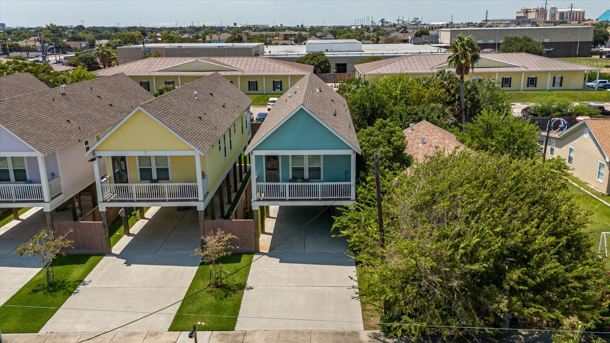 2301 67th Street Galveston, TX 77551 - Photo 2 of 46 a front view of a house with a garden