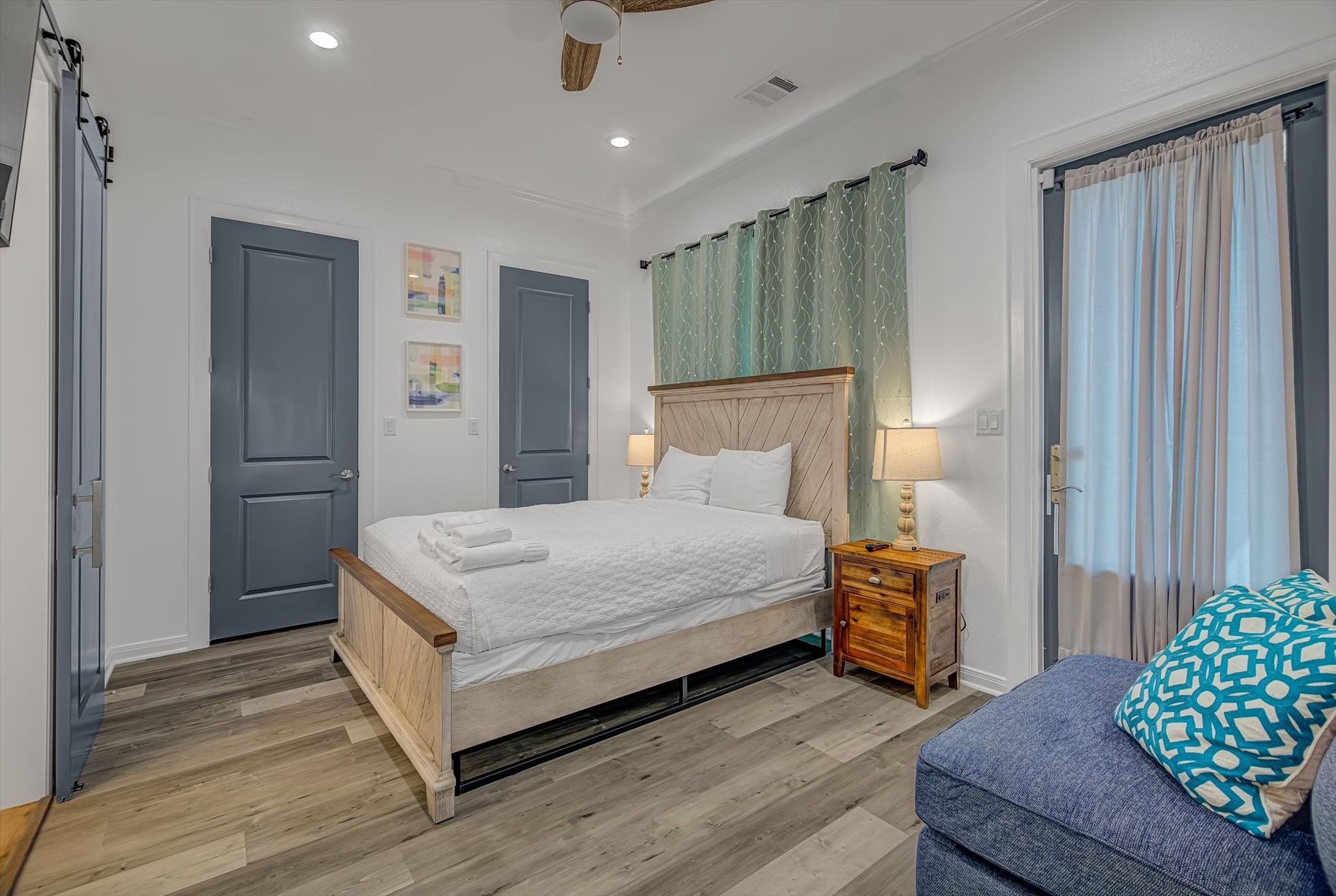 2301 67th Street Galveston, TX 77551 - Photo 27 of 46 a bedroom with a bed and a chair