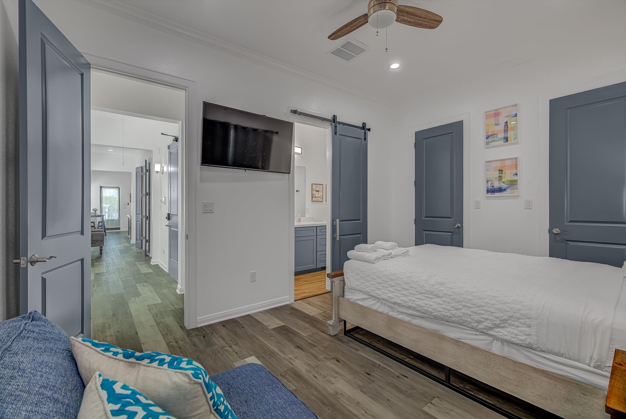 2301 67th Street Galveston, TX 77551 - Photo 29 of 46 a bedroom with a bed and wooden floor