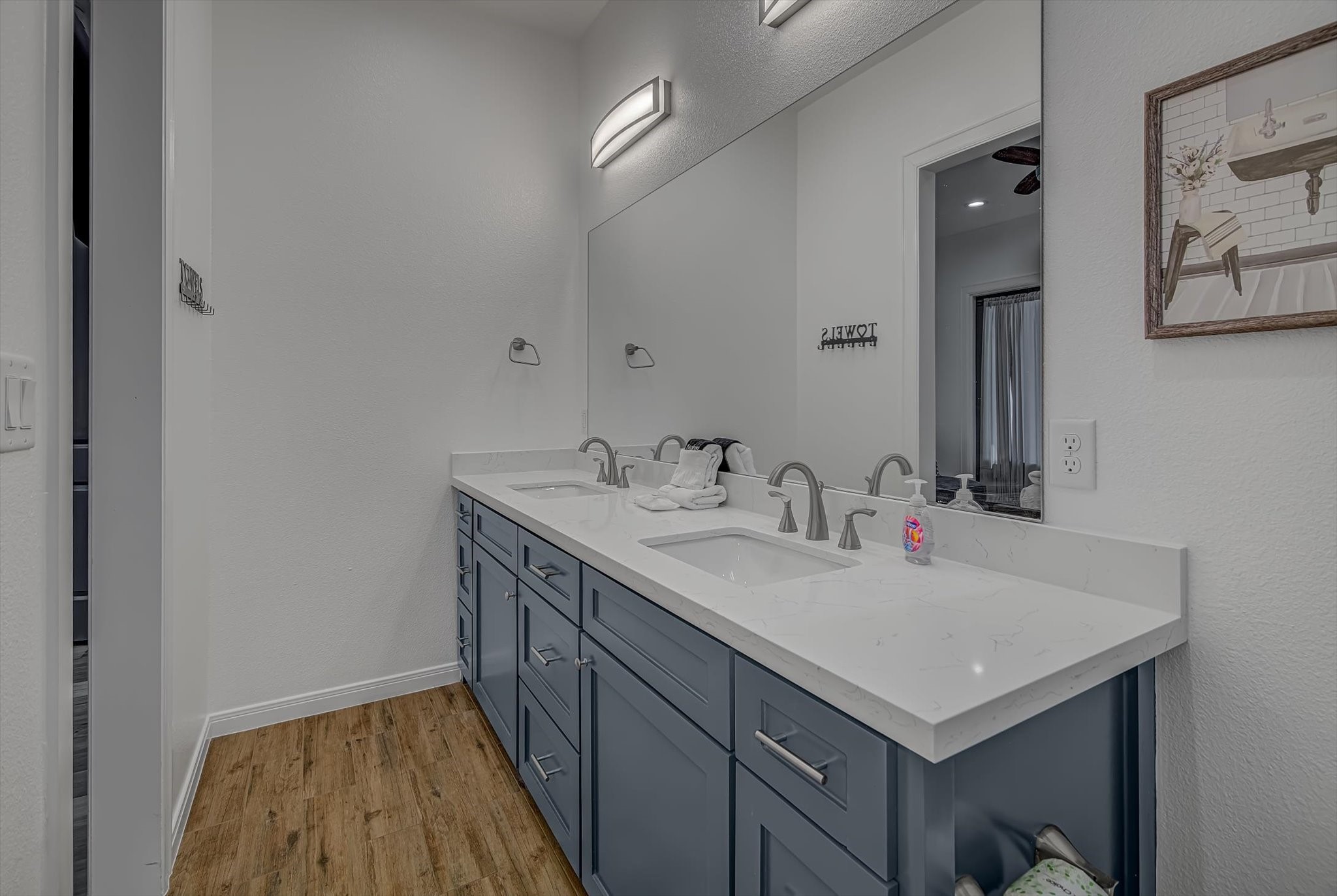 2301 67th Street Galveston, TX 77551 - Photo 31 of 46 a bathroom with a sink and a mirror