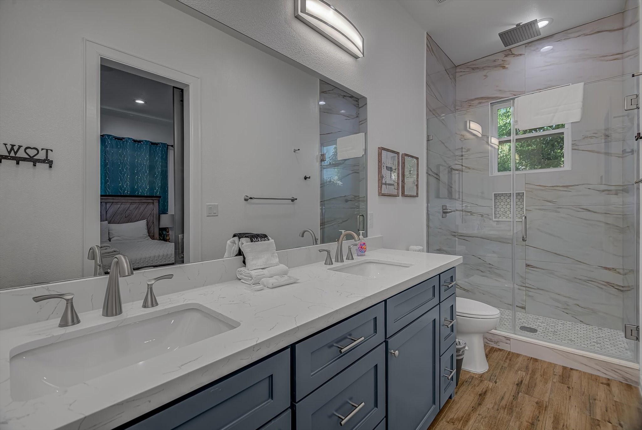 2301 67th Street Galveston, TX 77551 - Photo 33 of 46 a bathroom with a sink a toilet and shower