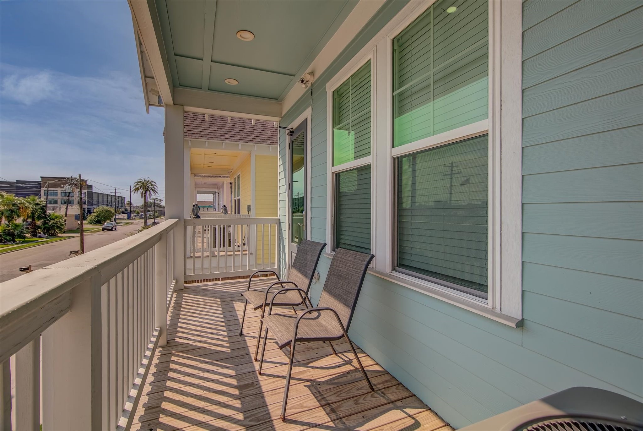 2301 67th Street Galveston, TX 77551 - Photo 43 of 46 a view of a balcony with chair and floor to ceiling window