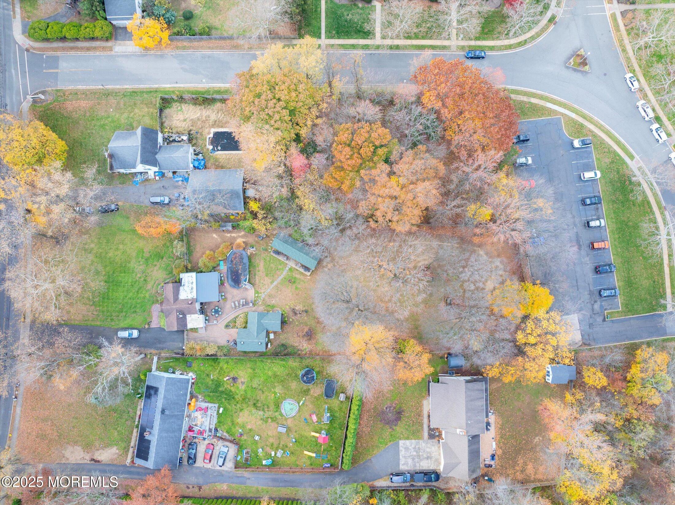 4 Sutton Place Matawan, NJ 07747 - Photo 8 of 12 a aerial view of a house with a yard and garden