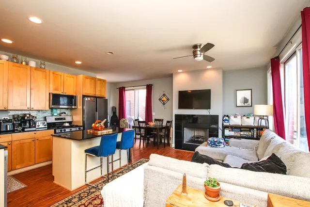 a living room with fireplace furniture and a flat screen tv