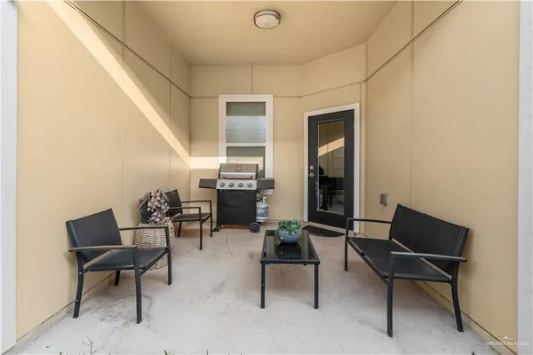 a view of a backyard with a garden and wooden fence