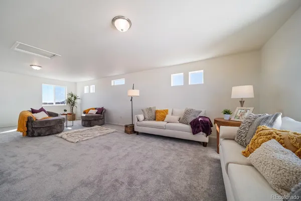 a living room with furniture and a couch
