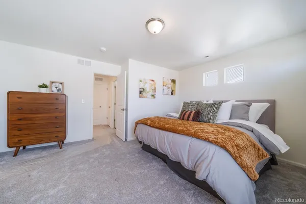 a bed room with a bed and furniture