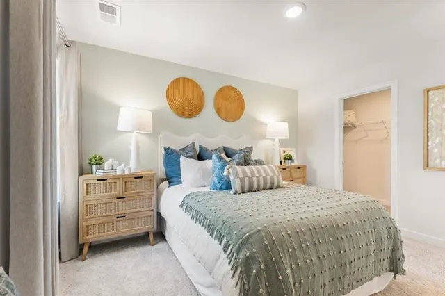 a bed room with a bed and dresser