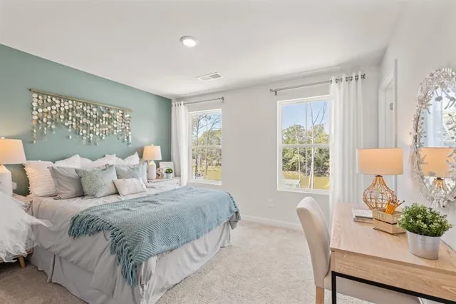 a bedroom with a bed and a table