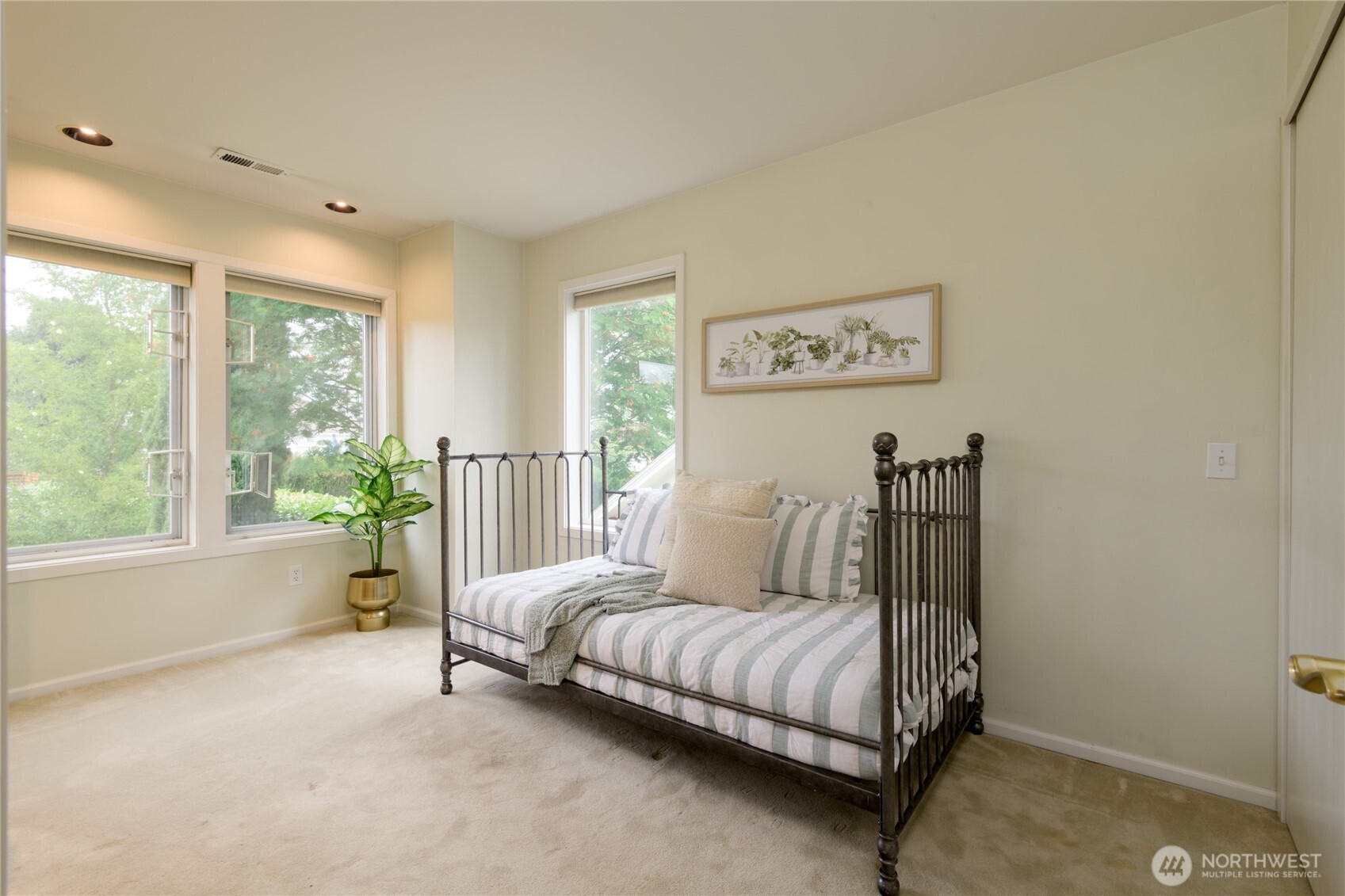2650 West Newton Street Seattle, WA 98199 - Photo 11 of 25 a bedroom with a bed lamp and a large window