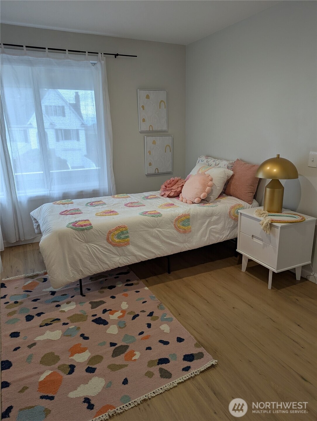 2650 West Newton Street Seattle, WA 98199 - Photo 15 of 25 a bedroom with a bed and wooden floor