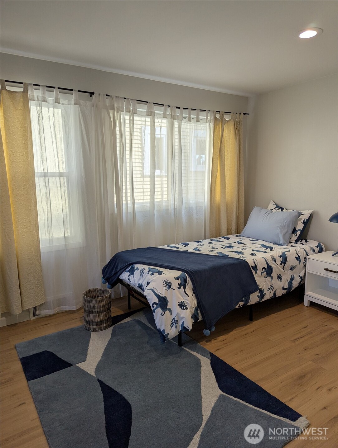 2650 West Newton Street Seattle, WA 98199 - Photo 16 of 25 a bedroom with a bed and a window