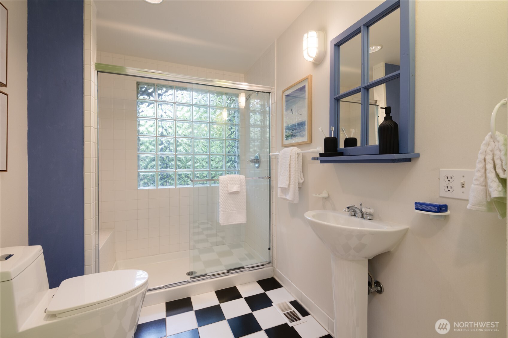 2650 West Newton Street Seattle, WA 98199 - Photo 18 of 25 a bathroom with a sink and a mirror