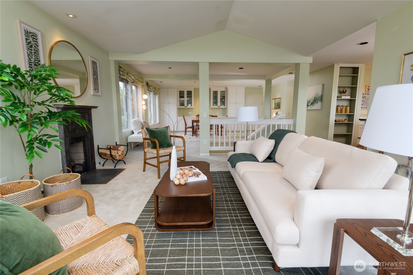 2650 West Newton Street Seattle, WA 98199 - Photo 5 of 25 a living room with furniture fireplace and a potted plant