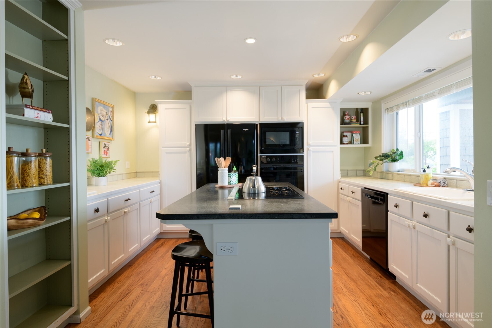 2650 West Newton Street Seattle, WA 98199 - Photo 7 of 25 a kitchen with counter top space and cabinets