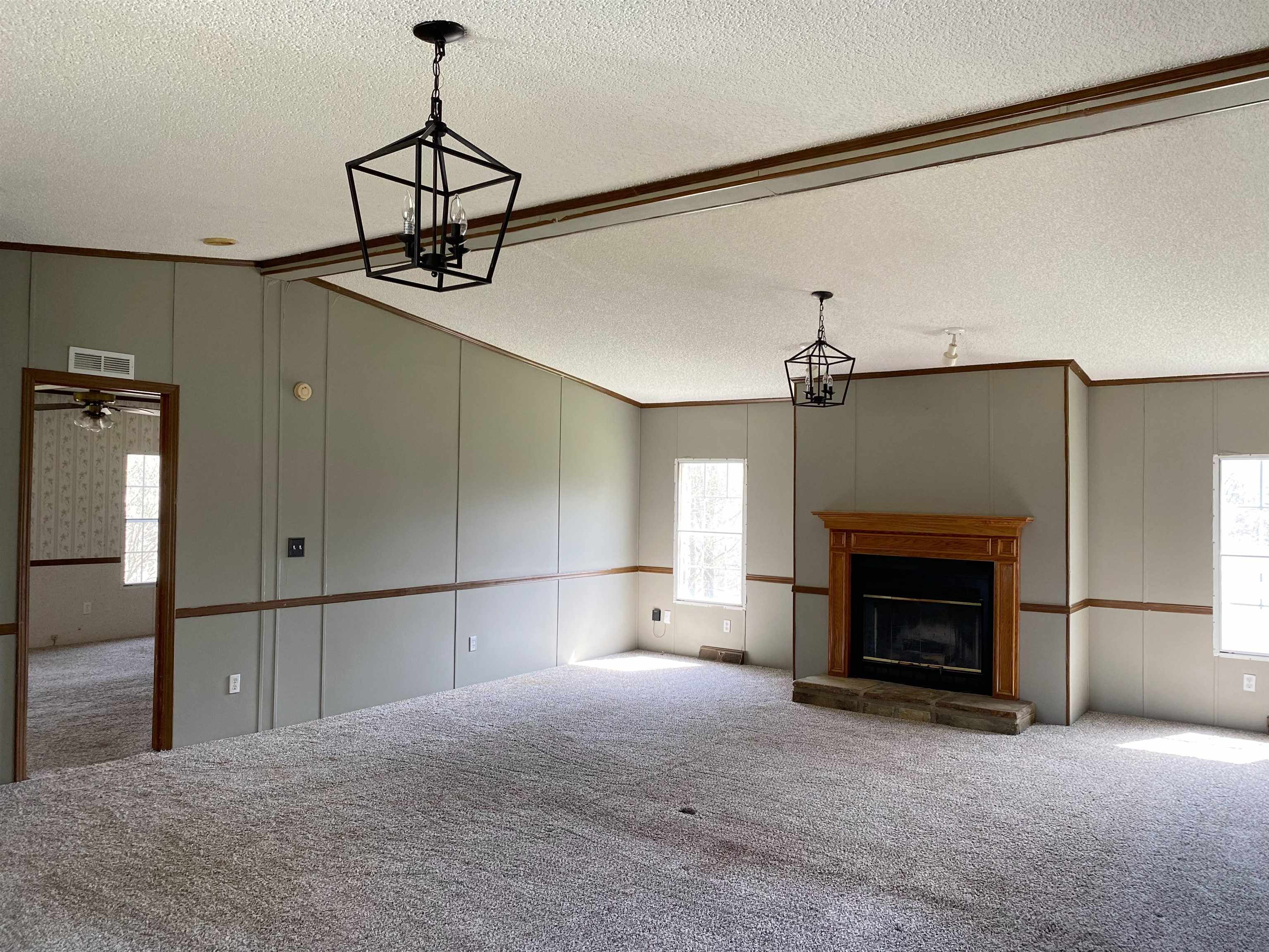 3737 Williams Switch Road Henning, TN 38041 - Photo 8 of 17 a view of a livingroom with a fireplace and cabinet