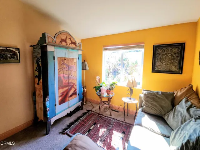 a living room with furniture and a gate