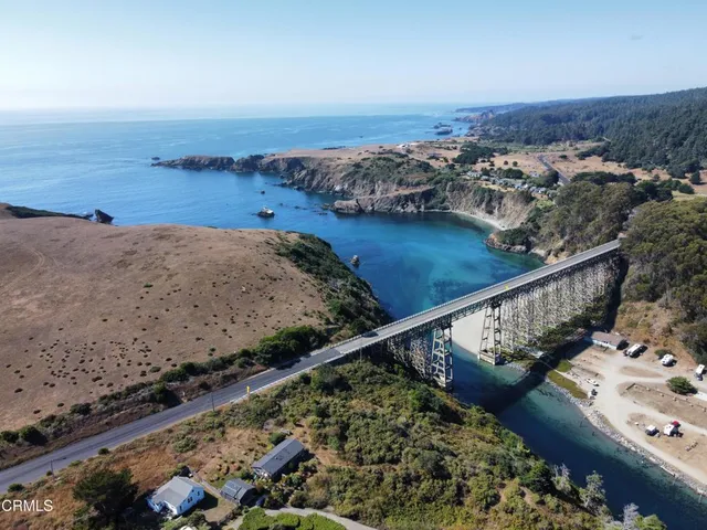 an aerial view of residential houses and outdoor space