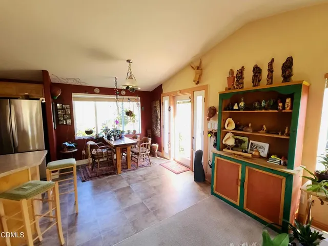 a kitchen with stainless steel appliances granite countertop a stove and a refrigerator
