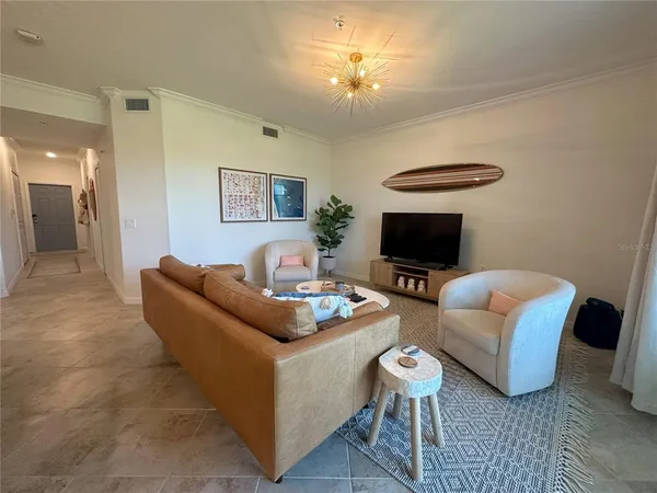 a bedroom with a bed and dresser with mirror