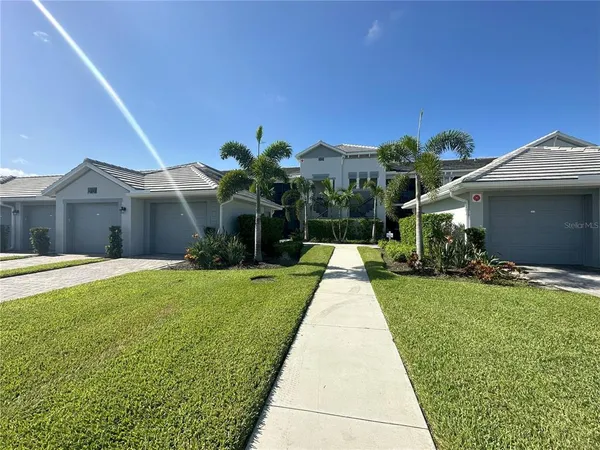 a front view of a house with yard