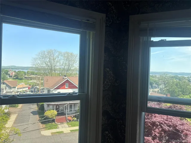 a view of a park with large trees