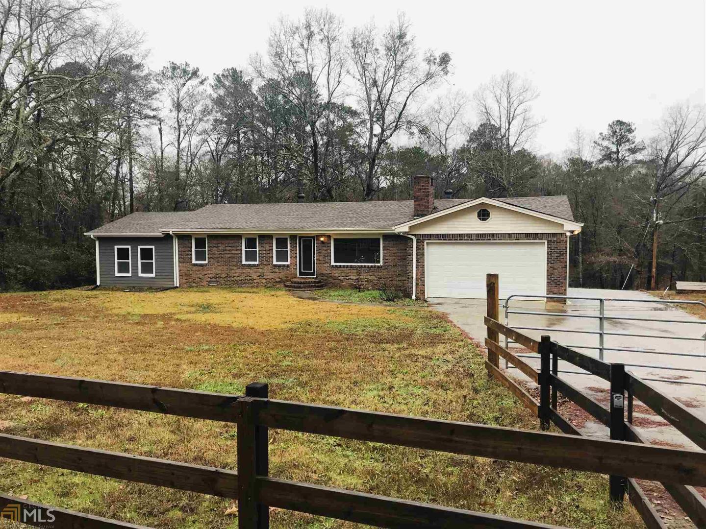 235 Jackson Lake Inn Road Jackson, GA 30233 - Photo 1 of 1 a view of a house with wooden deck and a backyard