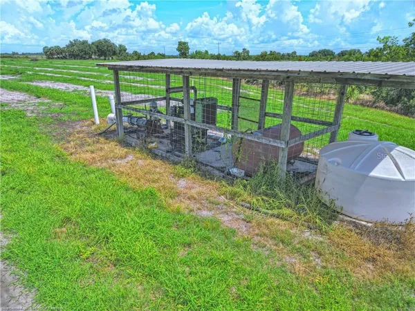 a view of a chair and table in the garden