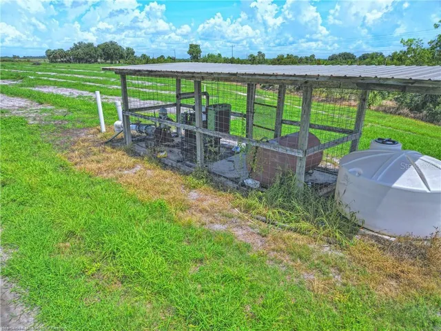 a view of a chair and table in the garden