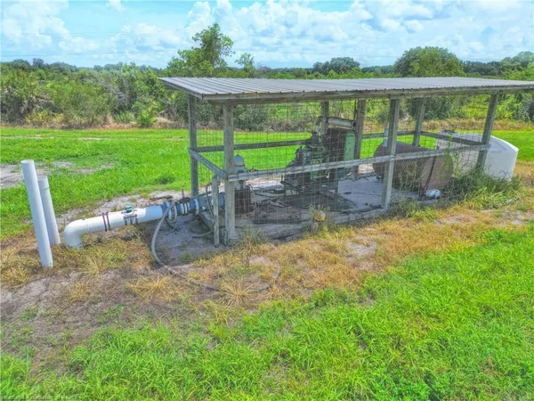 a view of a yard with a porch and a garden