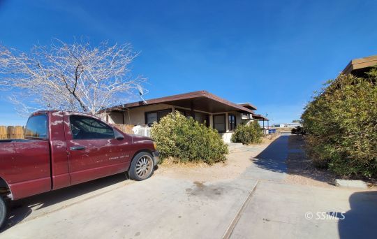 119 South Richmond Road Ridgecrest, CA 93555 - Photo 7 of 7 a car parked in front of a house