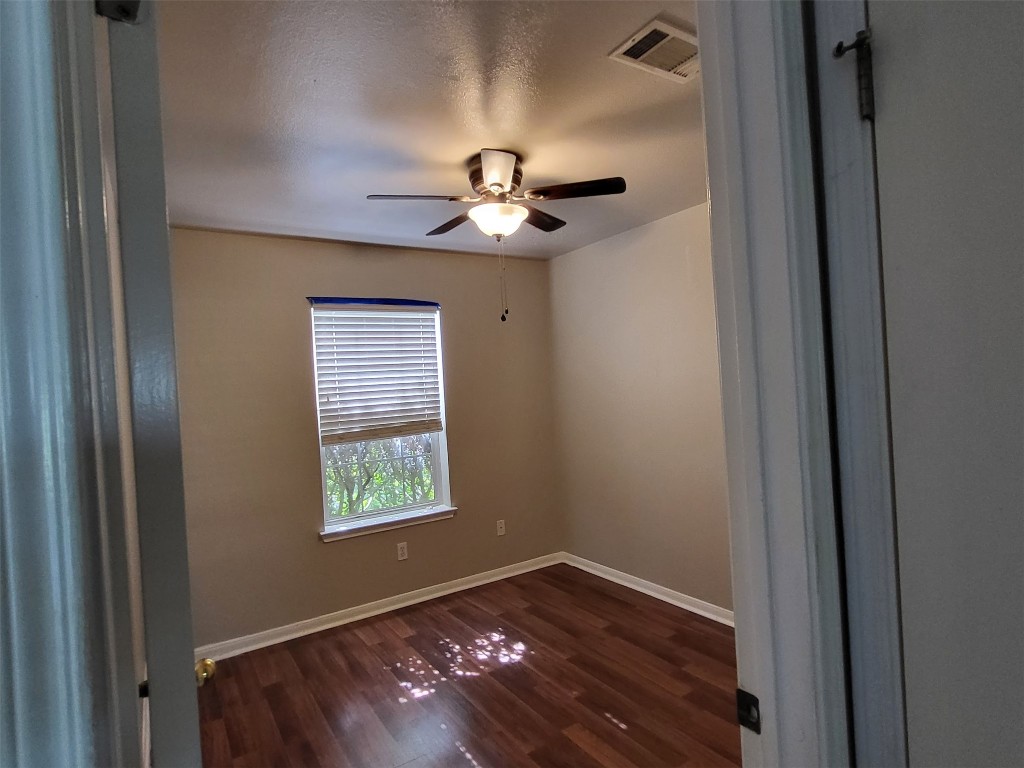 512 Maplecreek Drive Leander, TX 78641 - Photo 8 of 13 a view of an empty room with a window