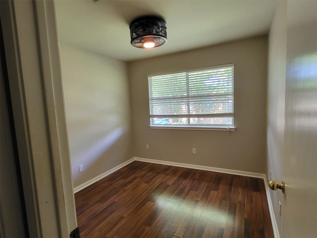512 Maplecreek Drive Leander, TX 78641 - Photo 9 of 13 a view of empty room with wooden floor and fan