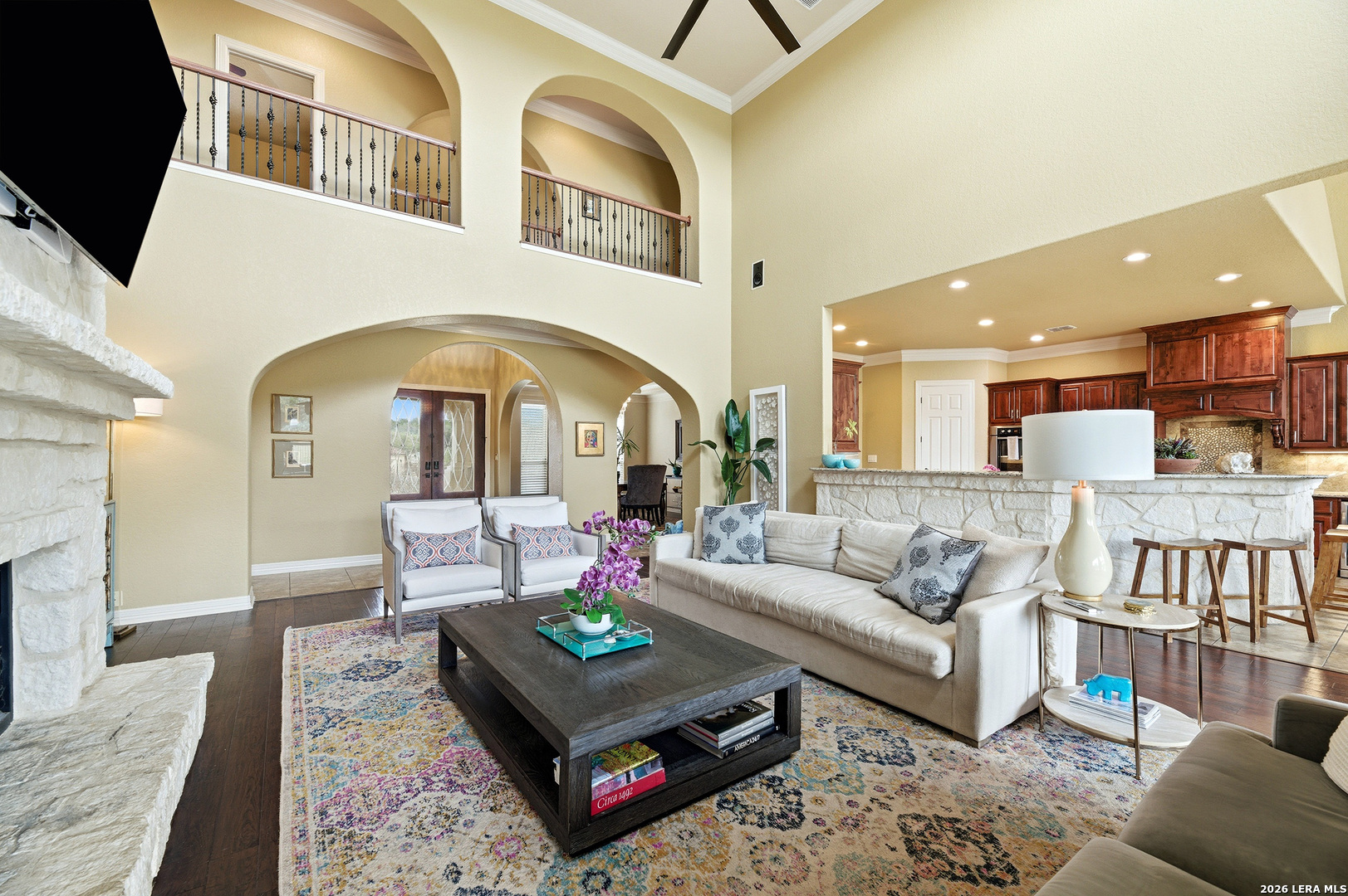 322 Santa Domingo Helotes, TX 78023 - Photo 13 of 47 a living room with furniture a rug and kitchen view