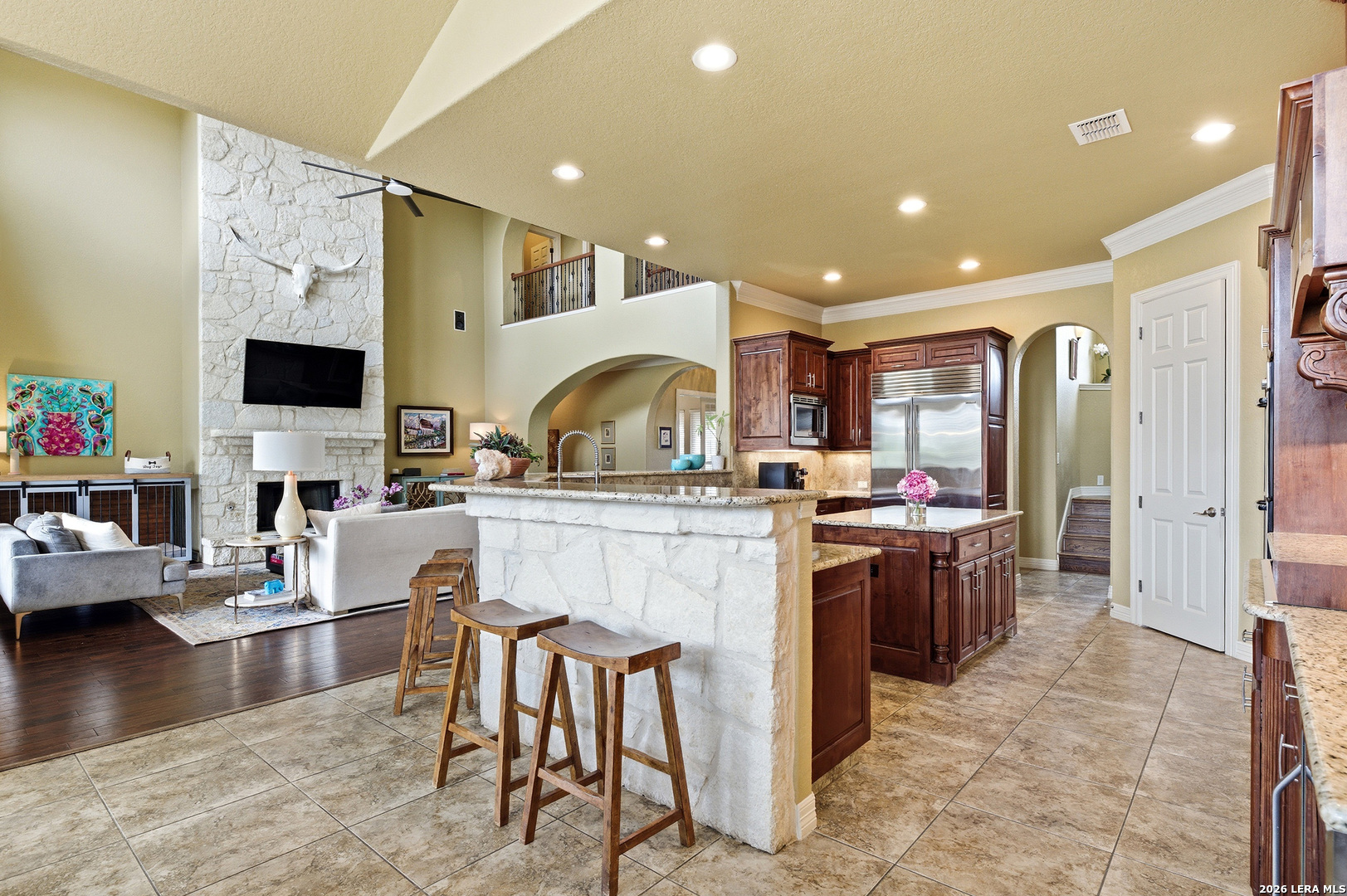 322 Santa Domingo Helotes, TX 78023 - Photo 14 of 47 a kitchen with kitchen island granite countertop a stove and a sink