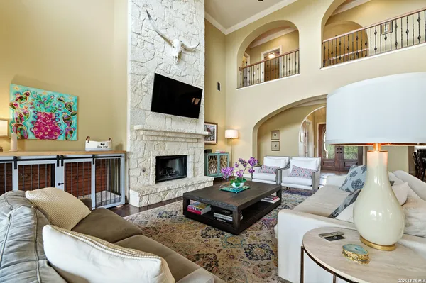 a living room with furniture fireplace and flat screen tv