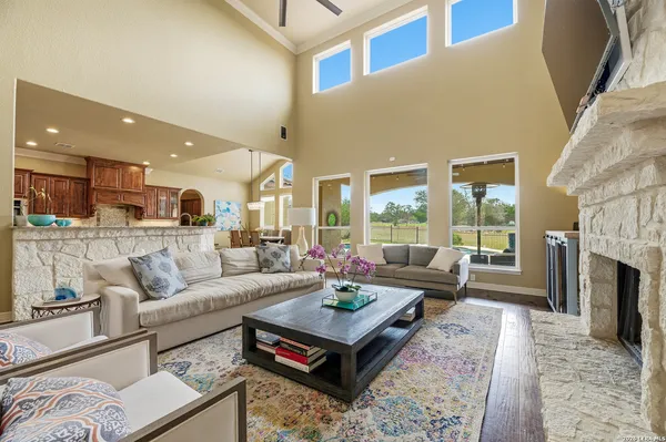 a living room with fireplace furniture and a fireplace