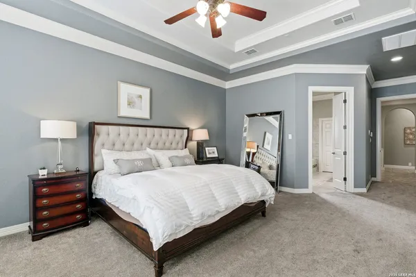 a bedroom with a bed and a lamp