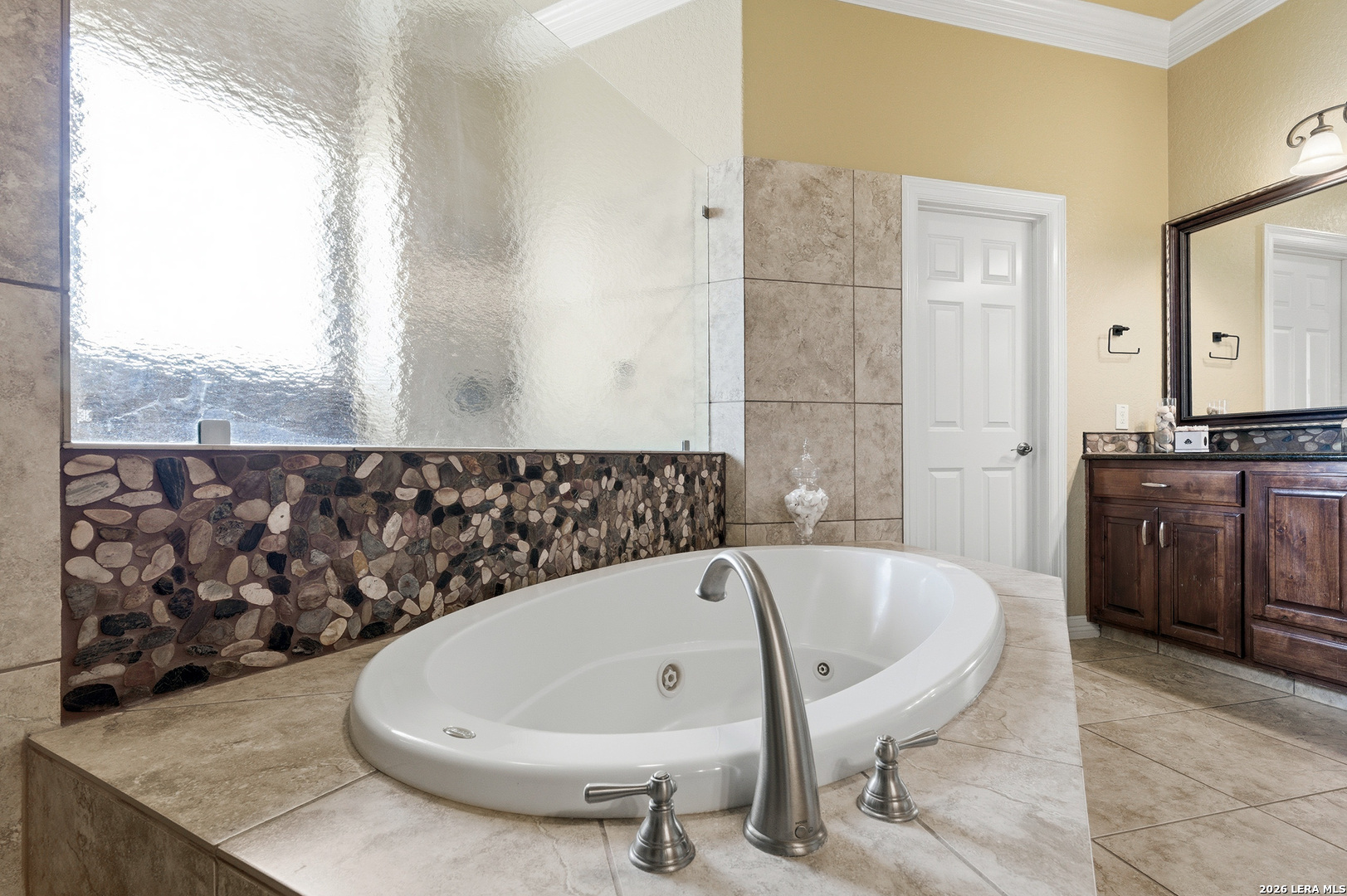 322 Santa Domingo Helotes, TX 78023 - Photo 24 of 47 a bath tub sitting in a bathroom next to a window