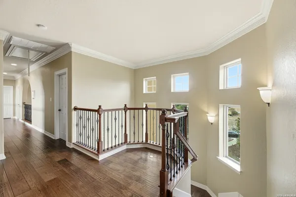a view of a hallway with staircase