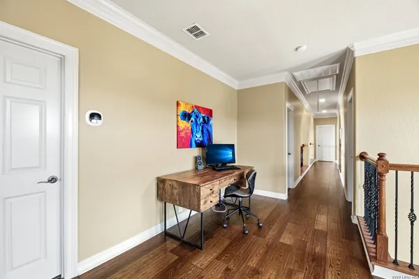 a workspace with furniture and wooden floor