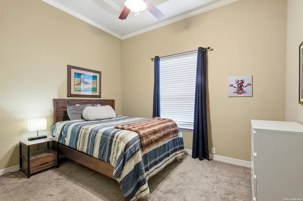 a bed room with a bed and a wall painting