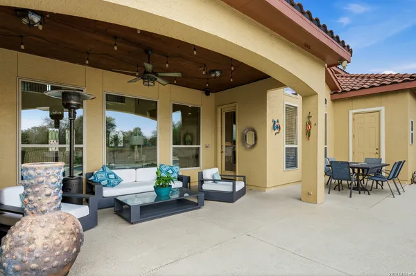 a outdoor living space with furniture and a potted plant