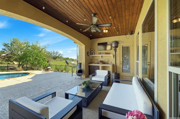 a view of a patio with swimming pool