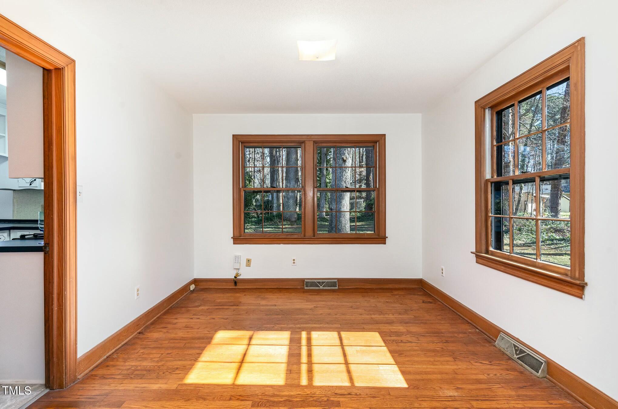6600 Clinton Place Raleigh, NC 27607 - Photo 10 of 35 a view of empty room with windows